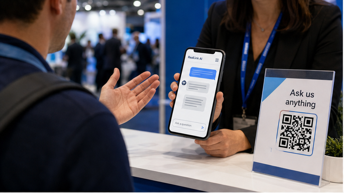 Trade show booth counter with a QR sign and phone showing a RealLink AI answer page
